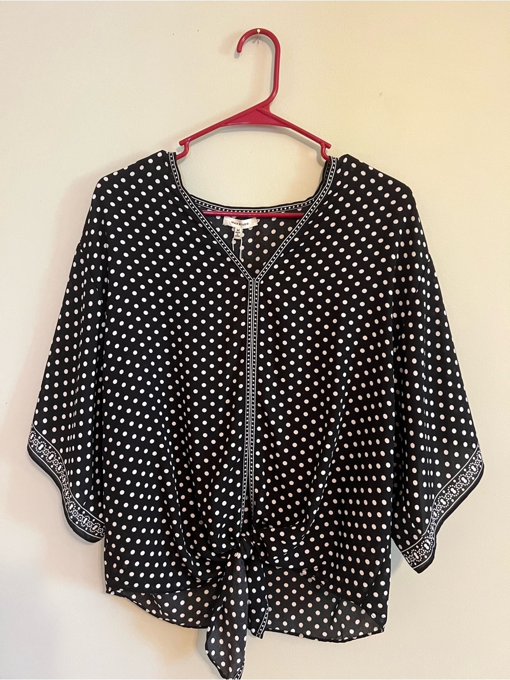 Women’s black and white polka dot top